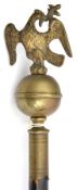 A religious staff with brass ball top surmounted by eagle, haft reduced to 37”. GC