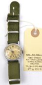 An “Elgin” wristwatch, plated case marked “US Ser No. 00-107928” on the back, luminous dial, green