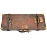 A brass bound leather covered fitted case, for a pair of DB guns with 28” barrels, red baize lined