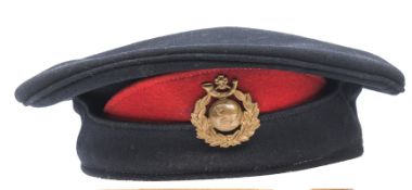 A scarce Other Rank’s blue cloth Brodrick cap of the Royal Marines Light Infantry, scarlet dummy “