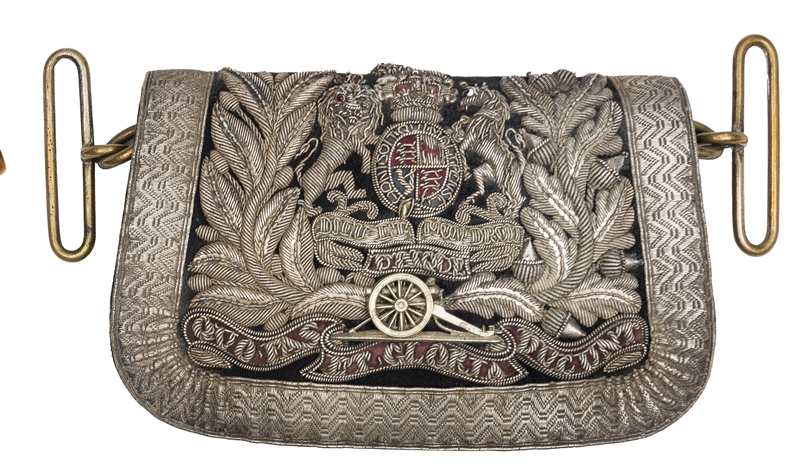 A Victorian officer’s pouch of the Volunteer Artillery, of blue cloth, silver lace border, the