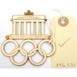 A Third Reich gilt and enamel 1936 Olympic Games car radiator badge (?), in the form of the