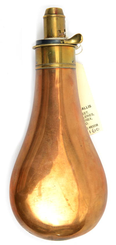 A plain copper powder flask, brass top marked “G & JW Hawksley, Sheffield”, graduated nozzle, 2¼