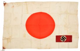 A WWII Japanese flag, 40” x 28”, leather covered reinforcers; also a Third Reich NSDAP arm band.