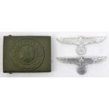 A Third Reich olive green painted aluminium Army buckle, no maker’s mark, and 2 plain aluminium