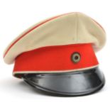An Imperial German Garde du Corps officer’s service dress cap, white cloth with red band and piping.