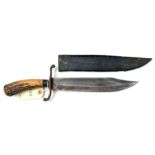 A 19th century Indian bowie type knife, broad clipped back blade 10”, the hilt with recurved iron