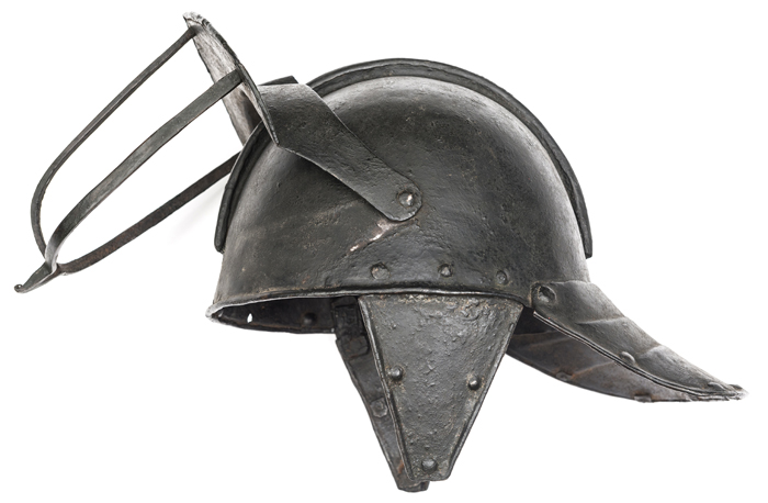 A Cromwellian lobster tail helmet, the domed 2 piece skull having low comb, hinged peak with