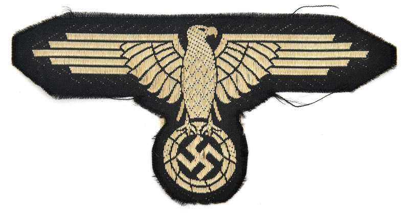 A Third Reich French made late war woven silk SS arm eagle. GC