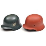 A Third Reich M1936 steel helmet, well refinished in army colours, GC (chinstrap not present);