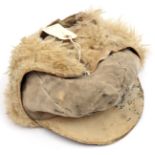 A Third Reich special issue Luftwaffe Russian front peaked cap, of fur lined soft white leather with