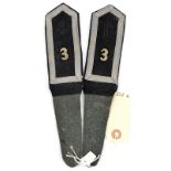 A Third Reich pair of 3rd SS Totenkopf Standarte “Thuringen” Scharfuhrer shoulder straps, with white