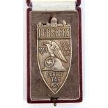 A Third Reich 1929 Nuremburg Party Rally non portable silver badge, the back with small stamp “F.