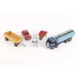 5 Dinky Toys. An Austin Somerset in red, a Foden Tanker with dark blue cab and light blue tank, a