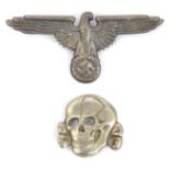 A Third Reich Waffen SS nickel plated cap eagle and skull pair, the eagle marked “RZM” and “M1/