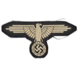 A Third Reich French made late war woven silk SS arm eagle. GC