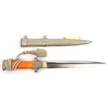 A Third Reich Red Cross Leader’s dagger, with unmarked blade and plated hilt with orange grip, in