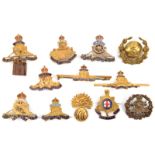 10 R Artillery sweetheart brooches: brass button in wreath and cannon in wreath, enamelled cannon (