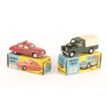 2 Corgi Toys. A Land Rover 109 WB (438) in dark green with tan tilt and shaped wheels. Together with