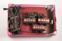 A small quantity of Hornby O gauge railway. Including; A clockwork M1 Passenger Set comprising 0-4-0