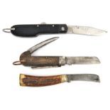 Another lot of 3: military type with blade, tin opener and spike, and with chequered horn