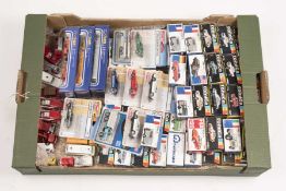 A quantity of Tomy Tomica 1:60, 1:55, 1:100, etc scale diecast vehicles. 56x boxed vehicles