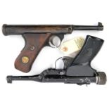 A Haenel air pistol similar to lot 802, no number visible, the walnut grips with inset brass