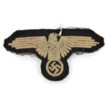 A Third Reich Waffen SS OR’s embroidered cloth arm eagle. GC