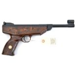 A .177” Weihrauch HW70 break action air pistol, number 082389, with mottled brown plastic stock.