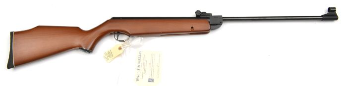 A .22” Webley Vulcan break action air rifle, number 023242, the stock with label attached “Gun