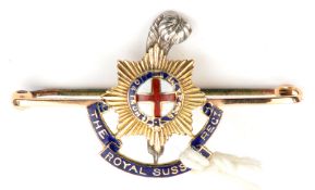 A tie pin brooch of The R Sussex Regt, red, white and blue enamelled, stamped “CP & Co/15 CT”. GC