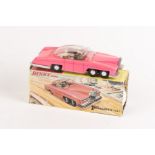 A Dinky Toys Lady Penelope's FAB1 (100). A scarce example with fluorescent pink body. Boxed with