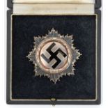 A Third Reich German Cross in silver, the thick heavy backplate having 4 small domed rivets, the