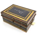 An officer’s steel writing case, painted black and panelled in red and gilt, lift out tray with