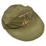A Third Reich tropical soft visored cap, of olive green cotton twill, with woven pale blue on