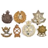 7 Commonwealth cap badges:W India Regt, officer’s bronze B.West Indies Regt, Barbados Vols,