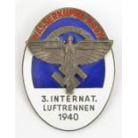 A Third Reich oval enamelled NSFK pin back badge, for “3. Internat. Luftrennen 1940, Wasserkuppe