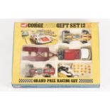 A Corgi Toys Gift Set 12, Grand Prix Racing Set. Comprising; Lotus Climax racing car (155) in orange