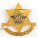 An officer’s gilt and silver plated badge of the Trinidad and Tobago Regt, maker’s mark “D.D.L. T/