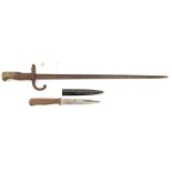 A German Trench knife, the 6” blade, crosspiece and tang formed in one piece, with plain wood grips,