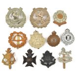 11 territorial cap badges: WM 7th Kings, 10th (Scottish) Kings (2), blackened 6th E Surrey, 5th