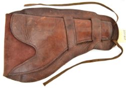 A brown leather American western revolver holster, with leg ties at base. GC