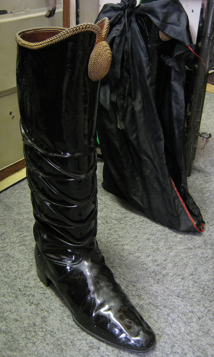 A pair of Hussar officers black PL boots, gilt braided tops with oval bosses, artificially