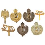 7 yeomanry cap badges: Dorset brass and bronze, and with “The Great War” scroll WM and bronze,