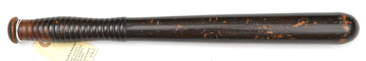 A Vic hardwood truncheon, with ribbed grip, maker’s mark on pommel of “Field Tavistock St. WC”.
