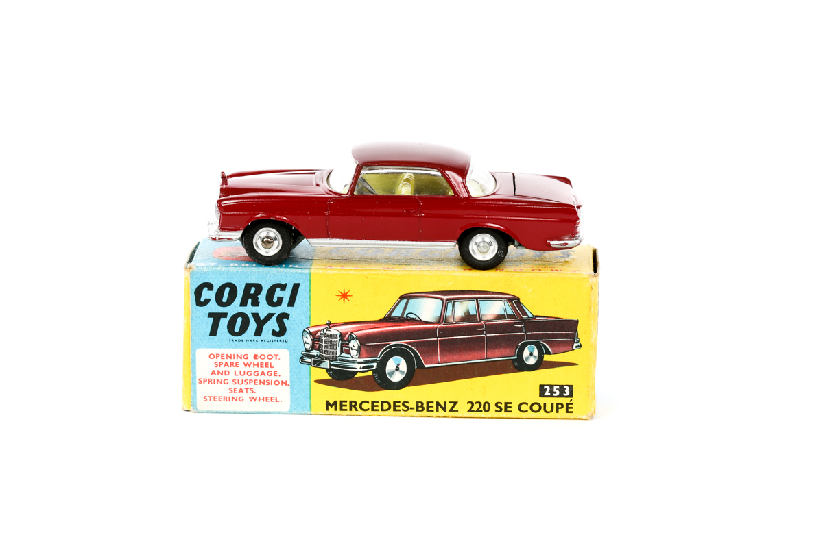 Corgi Toys Mercedes Benz 220SE Coupe (253). Example in maroon with yellow interior. Boxed, minor