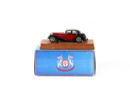 A RAE Models Miniature Classics MG SA Saloon. An example in black and red with light brown interior.