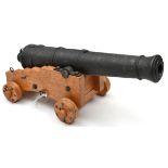 A well made model of a Georgian ship’s cannon, iron barrel 15¾”, on its 4 wheeled wooden carriage,