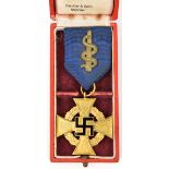 A Third Reich 1st class Faithful Service Decoration, in gilt and enamel, with ribbon, which has a