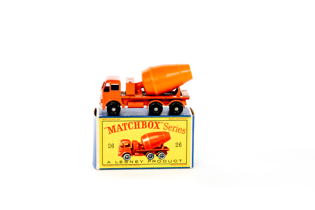 A Matchbox Series Foden Cement Mixer (26b). With orange cab, chassis and barrel. Black plastic